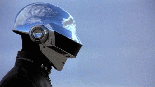Person in Silver Helmet with Headphones