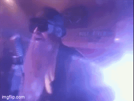 Person In Sunglasses And Beard Dancing In Dark Room GIF