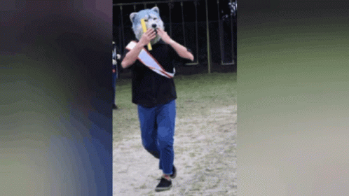 Person in Teddy Bear Mask Holding Banana