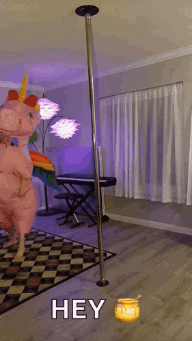 Person in Unicorn Costume by Pole