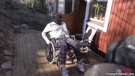 Person in Wheelchair by Weber Grill on Deck