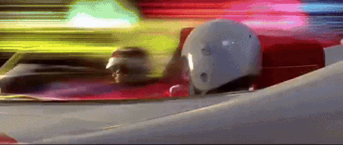 Person In White Helmet Driving Red And White Race Car GIF