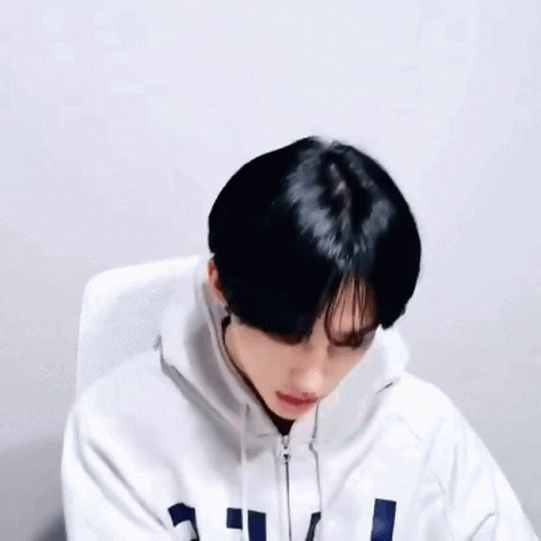 Person in White Hoodie with Black Hair