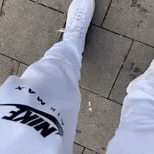 Person In White Nike Pants And White Shoes GIF