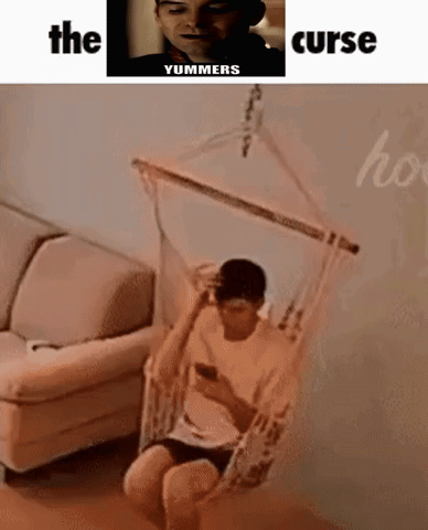 Person in Wizard Hat Sitting in Hammock