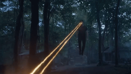 Person in Woods with Light from Hands