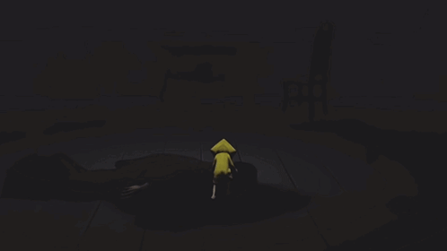 Person in Yellow Hat With Triangle