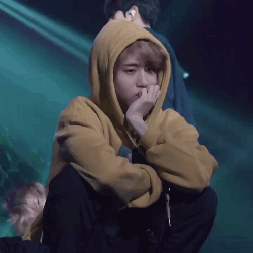 Person In Yellow Hoodie Covering Face GIF