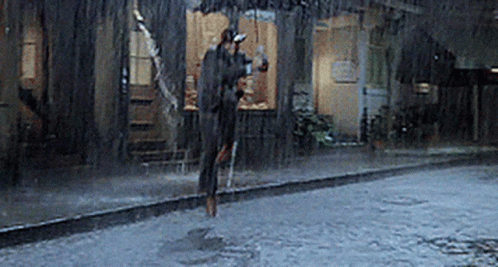 Person Jumping in Rain