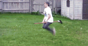 Person Jumping on Trampoline in Grassy Field