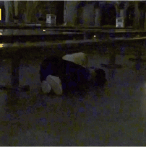 Person Laying In Front Of Yellow A Sign GIF