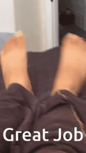 Person Laying On Bed Feet Up Saying Great Job GIF