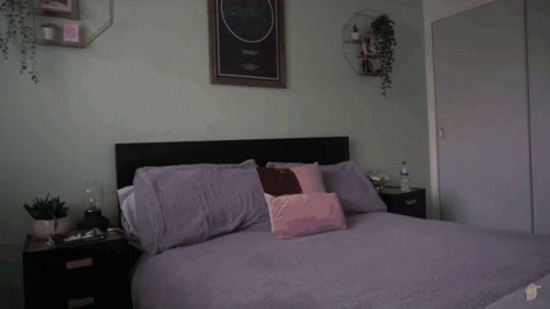 Person Laying on Bed With Starry Night Picture
