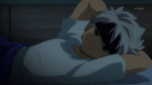 Person Laying on Bed With TV Saying BX Japan
