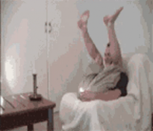 Person Laying on Couch With Legs in Air