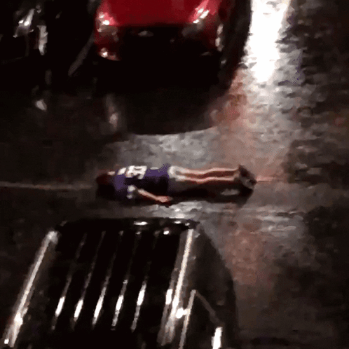 Person Laying On Ground In Purple Jersey Number 25 GIF