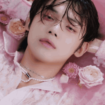 Person Laying on Pink Surface