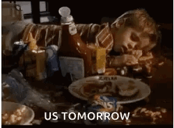 Person Laying On Table With Plate Of Food GIF