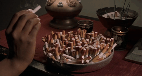 Person Lighting Cigarette GIF