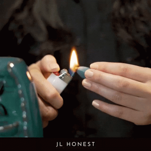 Person Lighting Lighter With Jl Honest