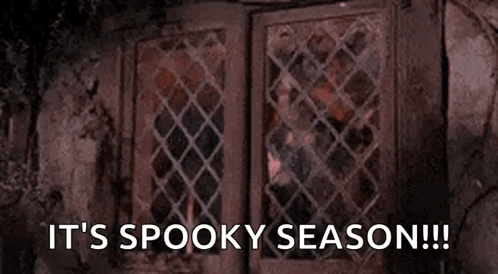 Person Looking Out Window It's Spooky Season