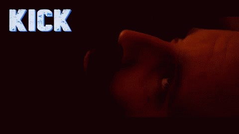 Person Lying in Dark With Kick