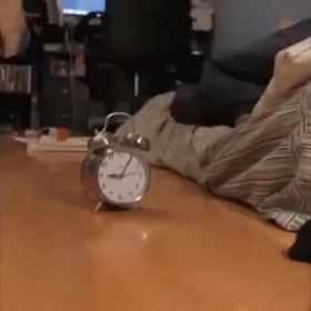 Person Lying Near Alarm Clock