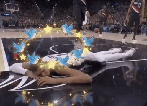 Person Lying on Basketball Court with Birds and Stars