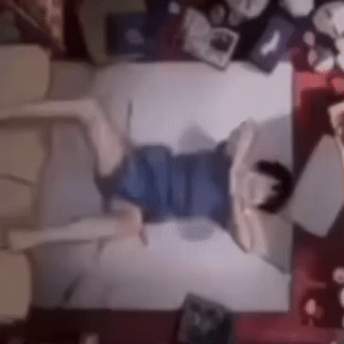 Person Lying On Bed With Crossed Legs GIF