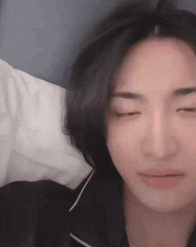 Person Lying On Bed With Eyes Closed GIF