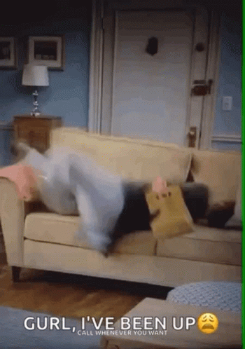 Person Lying on Couch with Bag of Food