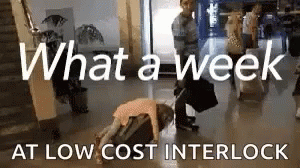 Person Lying On Suitcase Saying What A Week GIF