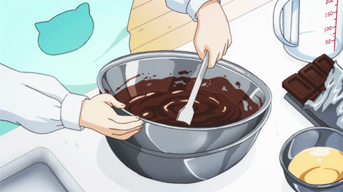 Person Mixing Chocolate in Metal Bowl