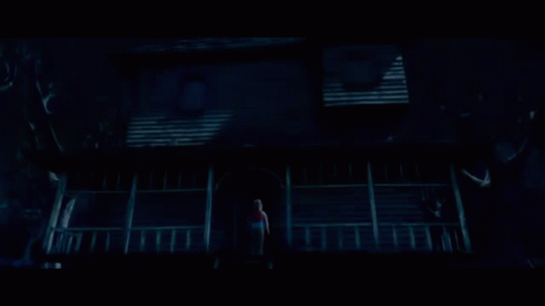 Person On Haunted House Porch GIF