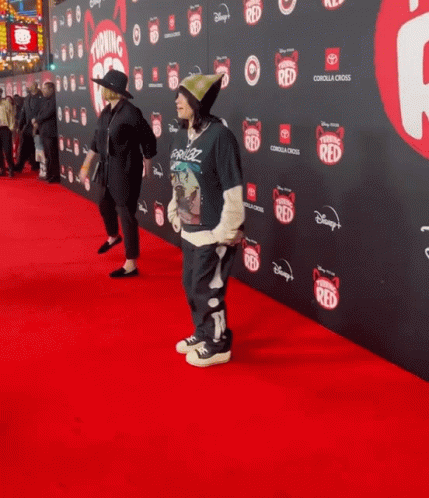 Person on Red Carpet With Disney Logo