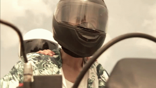 Person On Shoulder In Motorcycle Helmet GIF