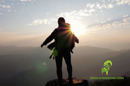 Person On Top Of Mountain With Bookatrekking.com Logo GIF
