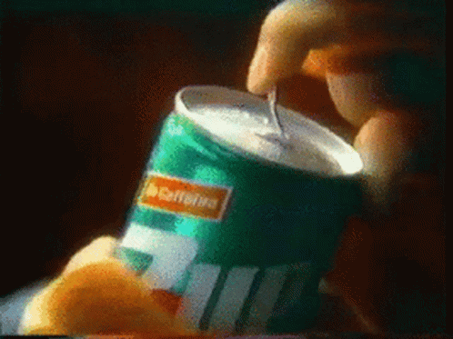 Person Opening 7 Up Can With Straw