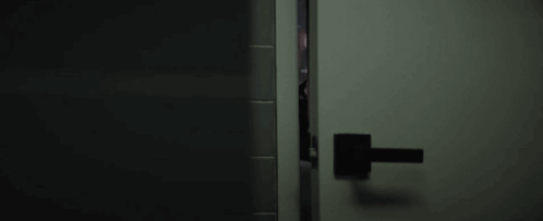 Person Peeking Through Door