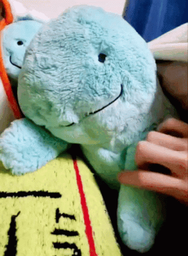 Person Petting Stuffed Animal On Blanket GIF