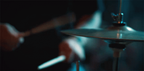 Person Playing Cymbal With Drum Stick