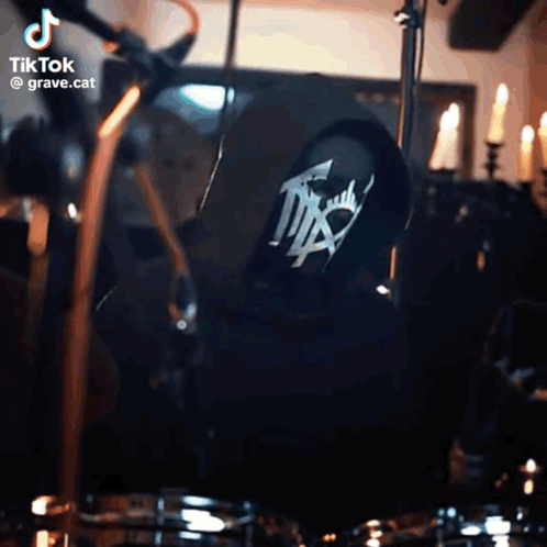Person Playing Drums with grave.cat