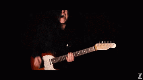 Person Playing Guitar With Letter X