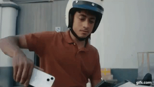 Person Playing IPod Saying Tehat GIF