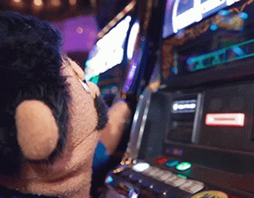 Person Playing Slot Machine With Red A Sticker GIF