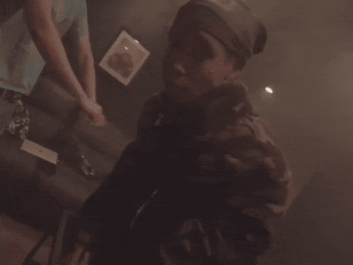 Person Playing Video Game In Dark Room With Purple Lights GIF