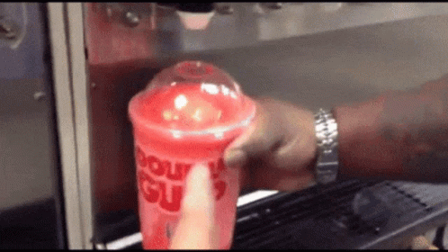 Person Pouring Drink Into Cup Saying Donut Slush GIF
