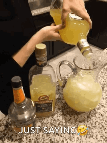 Person Pouring Margarita Into Pitcher