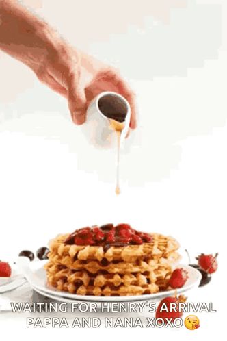 Person Pouring Syrup Over Waffles With Strawberries GIF