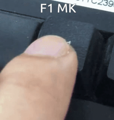 Person Pressing F1 Key On Black Keyboard GIF
